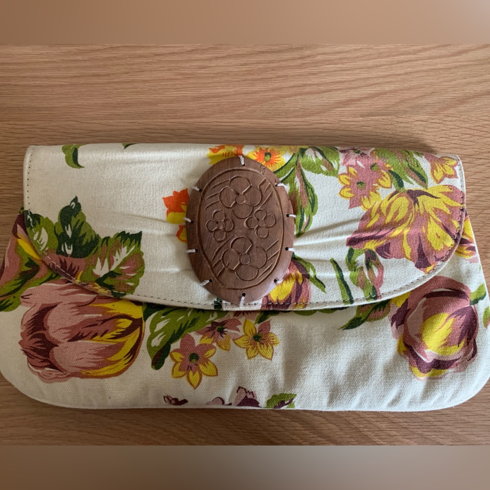 100% Cotton mid-size, unique clutch with wooden medallion and floral print